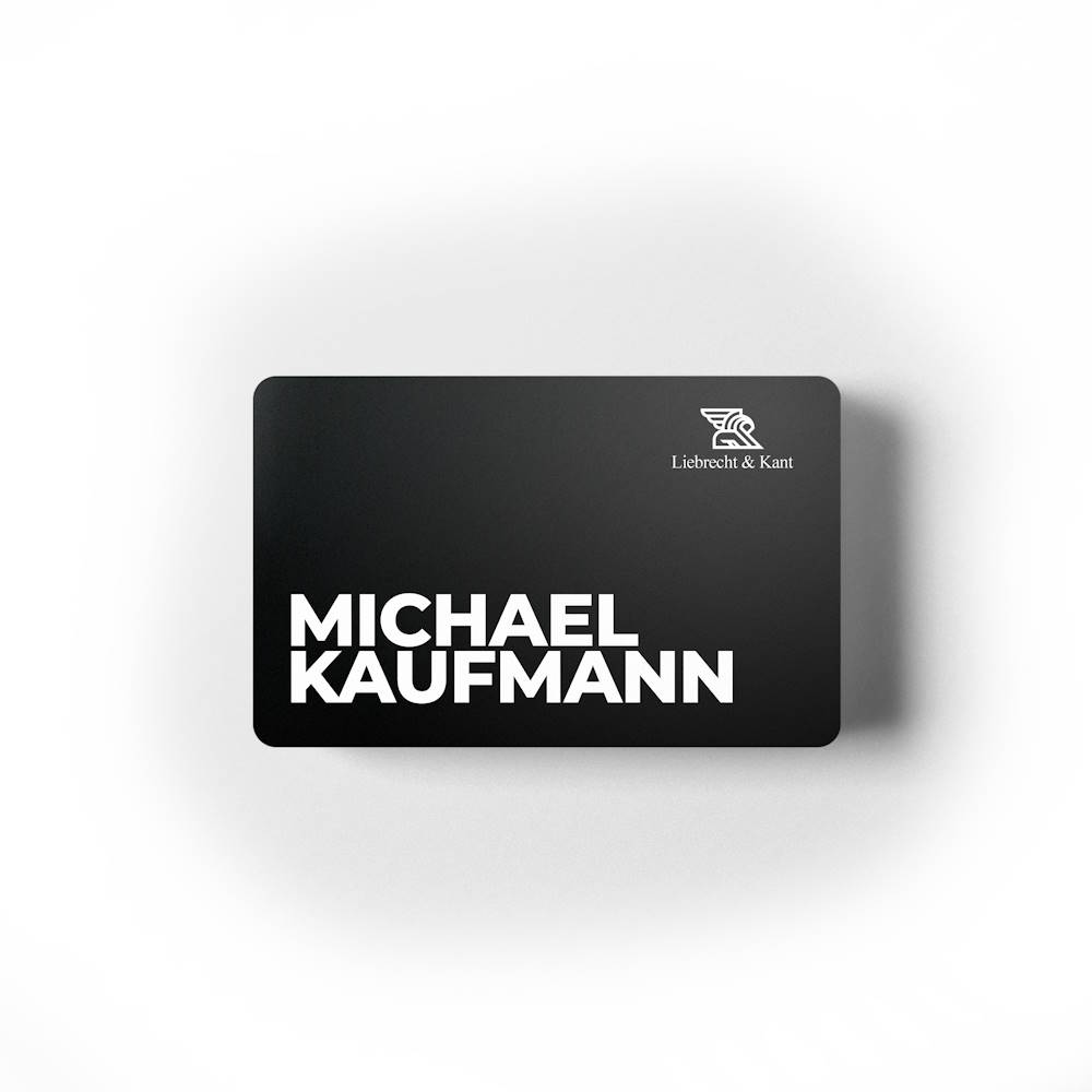 Modern black business card for Michael Kaufmann with Liebrecht & Kant logo.